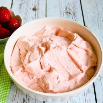 White Bowl filled with pink Strawberry Whipped Cream Cheese filling.