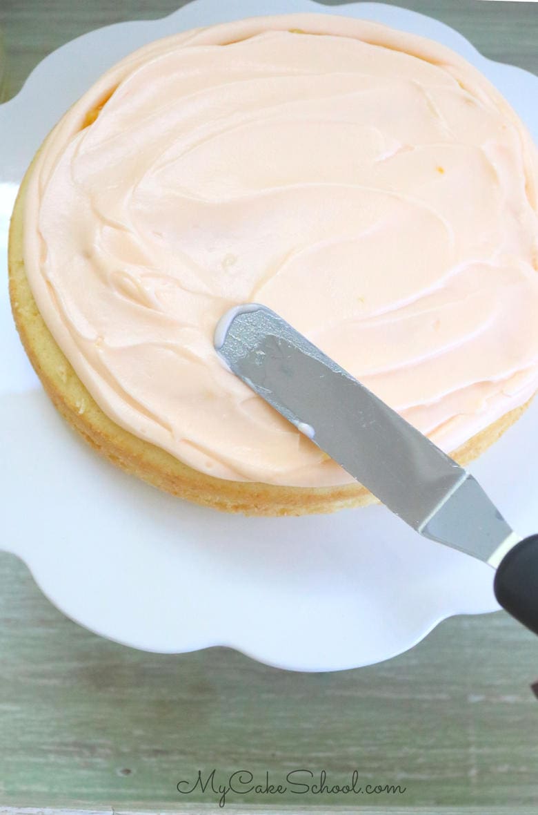 This Lemon Orange Cake Recipe is so moist and delicious! Lemon cake layers with orange curd filling and orange cream cheese frosting. Yum!!