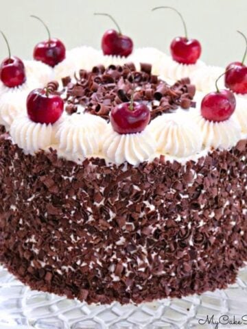 Black Forest Cake on glass pedestal.