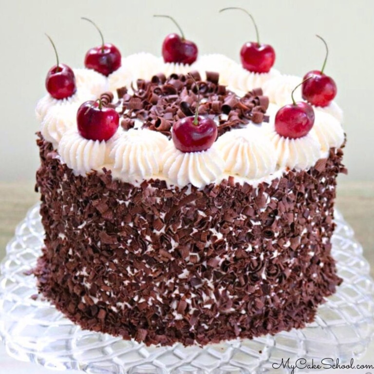 Black Forest Cake on glass pedestal.