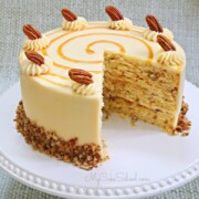 Toffee Pecan Caramel Cake on white pedestal