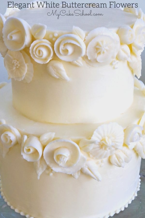 This elegant white on white buttercream floral cake design is perfect for weddings and bridal showers. From My Cake School's member cake tutorial section.