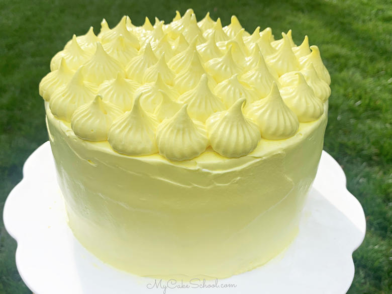 This Lemon Sour Cream Cake recipe is the BEST! Tastes amazing with Lemon Seven Minute Frosting!