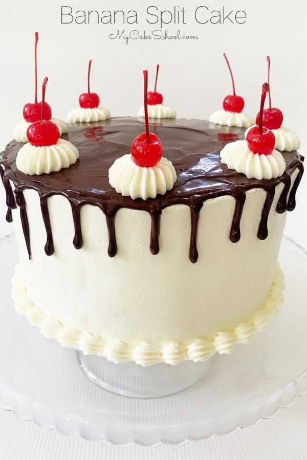 This Banana Split Layer Cake Recipe is the best! It has so much flavor in every bite, from banana cake layers to sliced strawberries, crushed pineapple, whipped cream cheese frosting, and a chocolate drizzle! This Banana Split Layer Cake recipe is amazing!