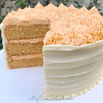 Butterscotch Cake, sliced, on a cake pedestal.