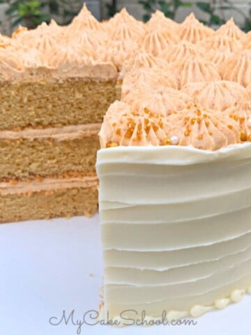 Butterscotch Cake, sliced, on a cake pedestal.