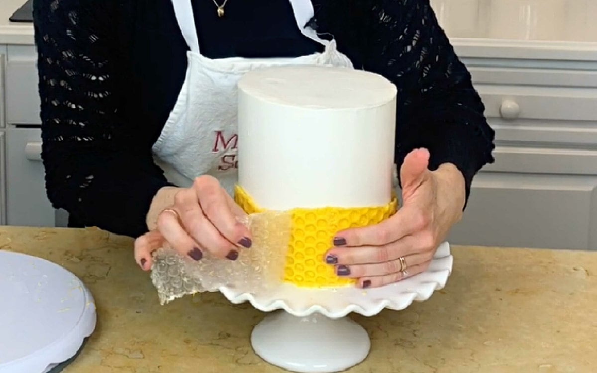 Peeling away bubble wrap from chilled chocolate wrap to reveal honeycomb pattern.