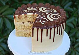 This moist Peanut Butter Cake starts with a cake mix! It is so delicious with peanut butter cream cheese frosting and a decadent ganache drip!