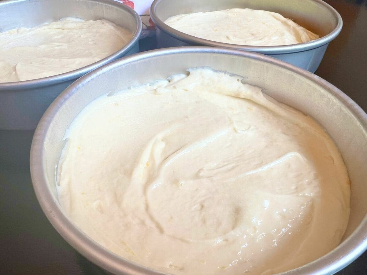 Lemon Buttermilk Cake Batter in cake pans.