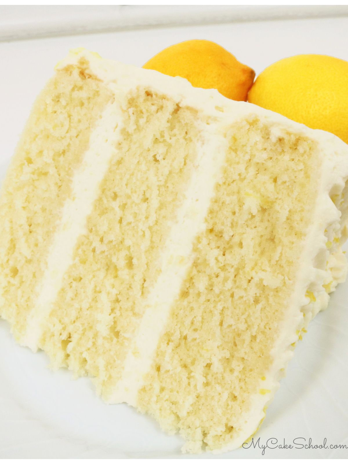 Slice of lemon buttermilk cake on a plate.