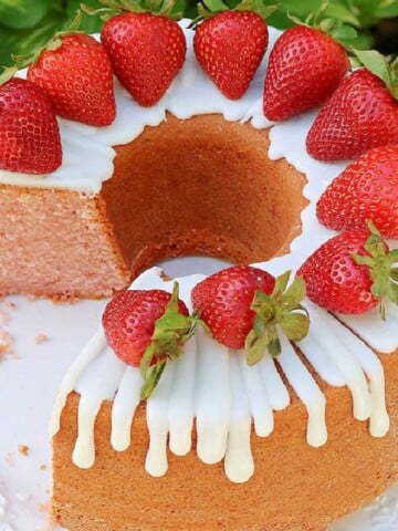 Moist strawberry pound cake on glass pedestal