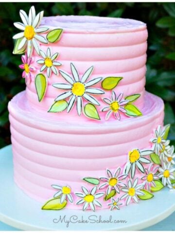 Painted Daisy Cake on a pedestal.