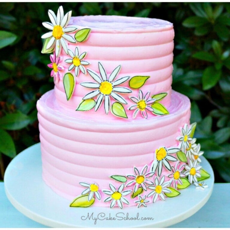 Painted Daisy Cake on a pedestal.