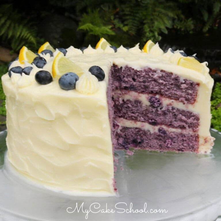 Sliced Blueberry Cake on a cake plate.