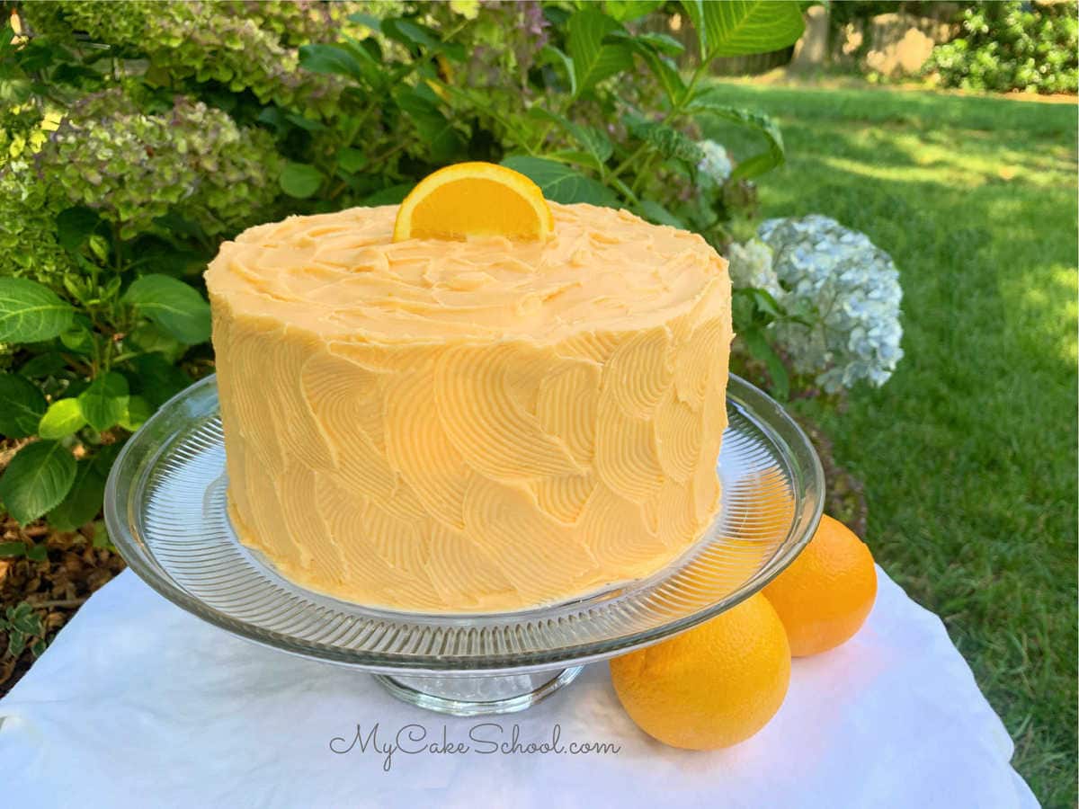 Orange Dreamsicle Cake- A Doctored Cake Mix Recipe- SO moist and delicious!