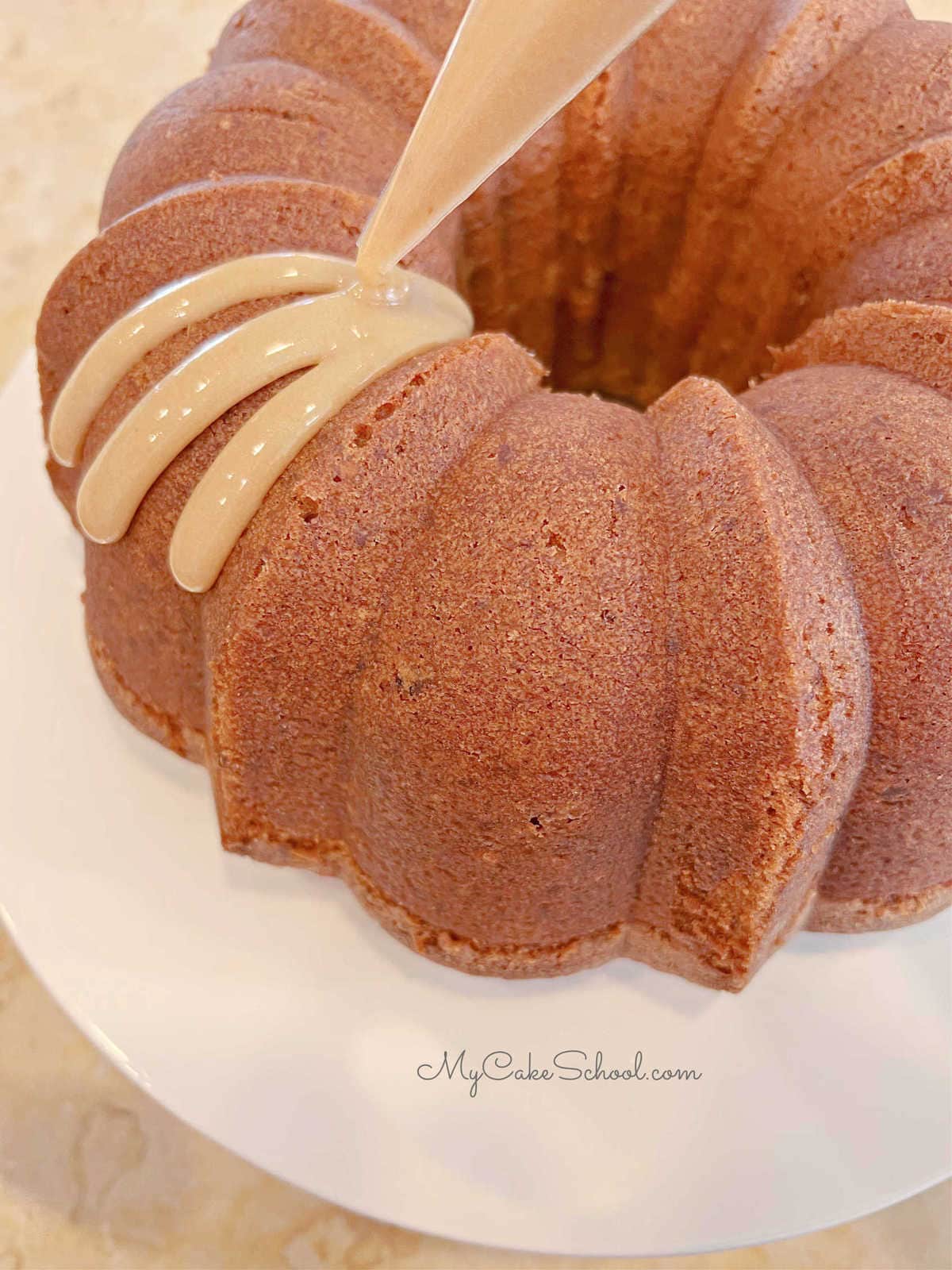 Pecan Caramel Bundt Cake- Drizzling the Caramel