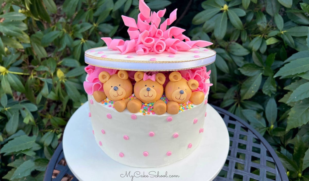 Teddy Bear Gift Cake on a white pedestal