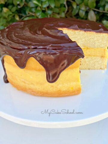 Boston Cream Pie on White Pedestal