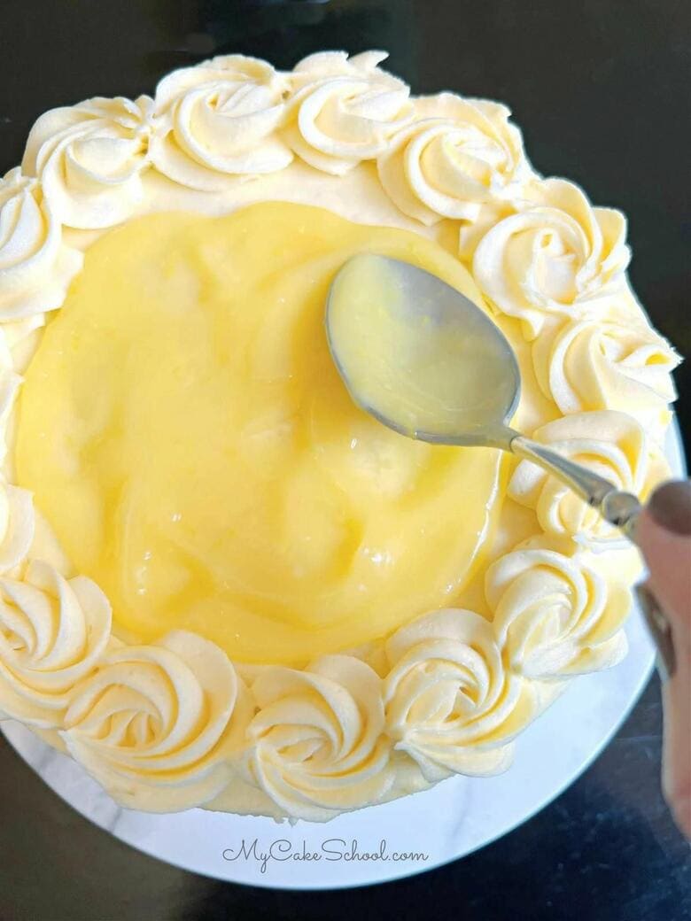 Lemon Velvet Cake topped with Lemon Curd