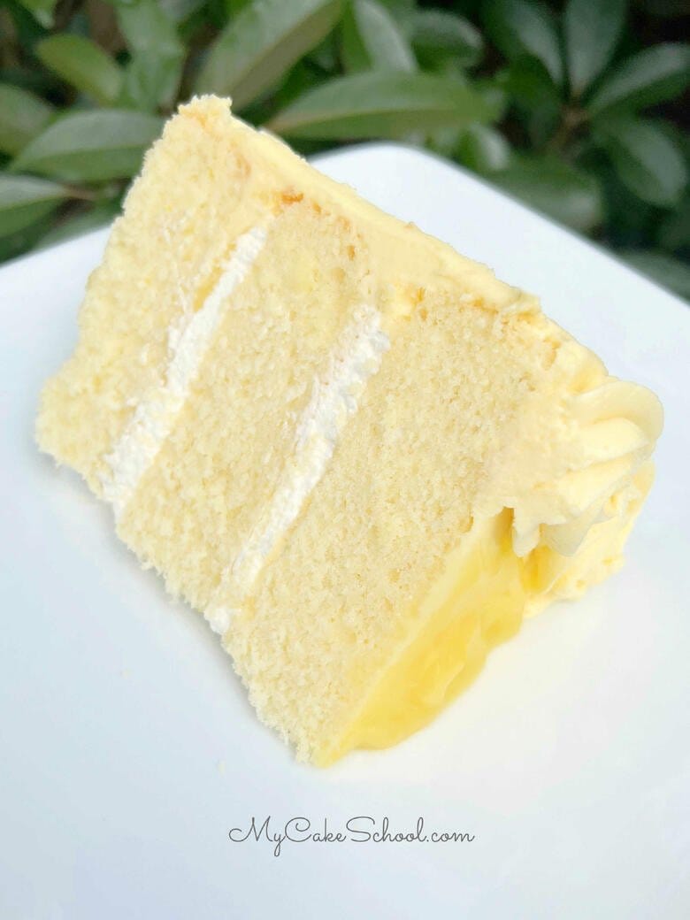 Lemon Velvet Cake Slice with Lemon Curd and Whipped Cream filling