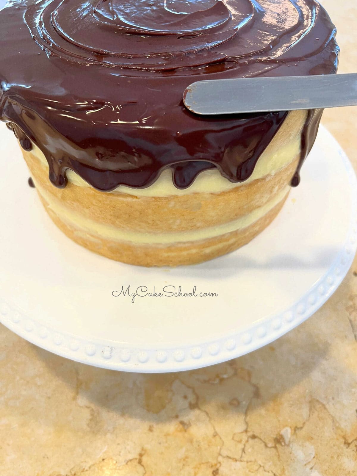 Moist Boston Cream Pie with Chocolate Glaze and pastry cream filling! Boston Cream Pie