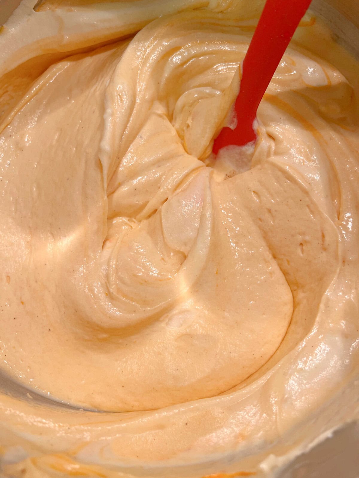 Orange Vanilla Bean Cake batter in a mixing bowl.