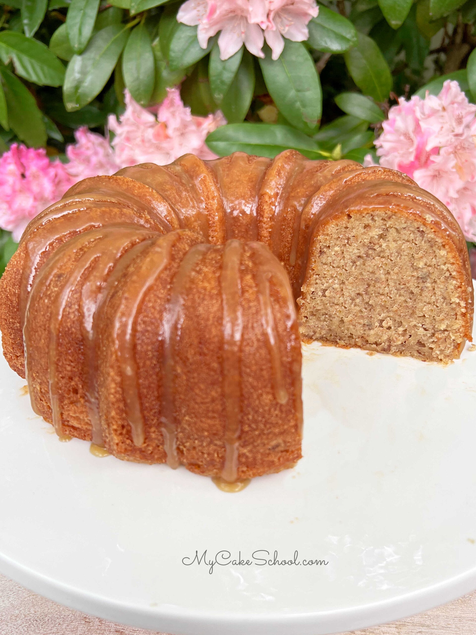 Banana Bundt Cake, sliced, on a pedestal.