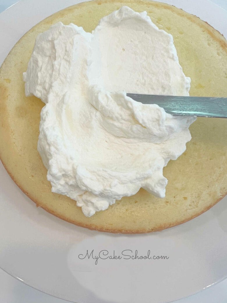Spreading Limoncello Cake Layer with Frosting