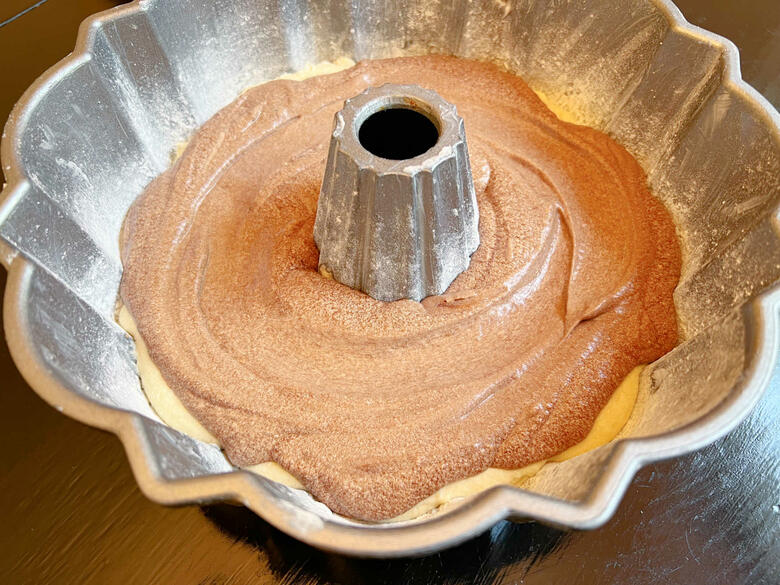 Layering Vanilla and Chocolate Batter in pan for Marble Cake