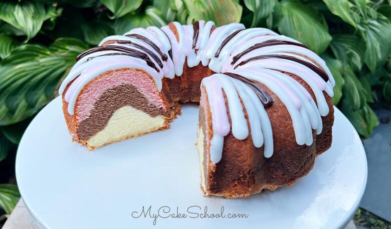 Neapolitan Pound Cake- This moist pound cake is beautiful when sliced, and has amazing vanilla, chocolate, and strawberry flavor!