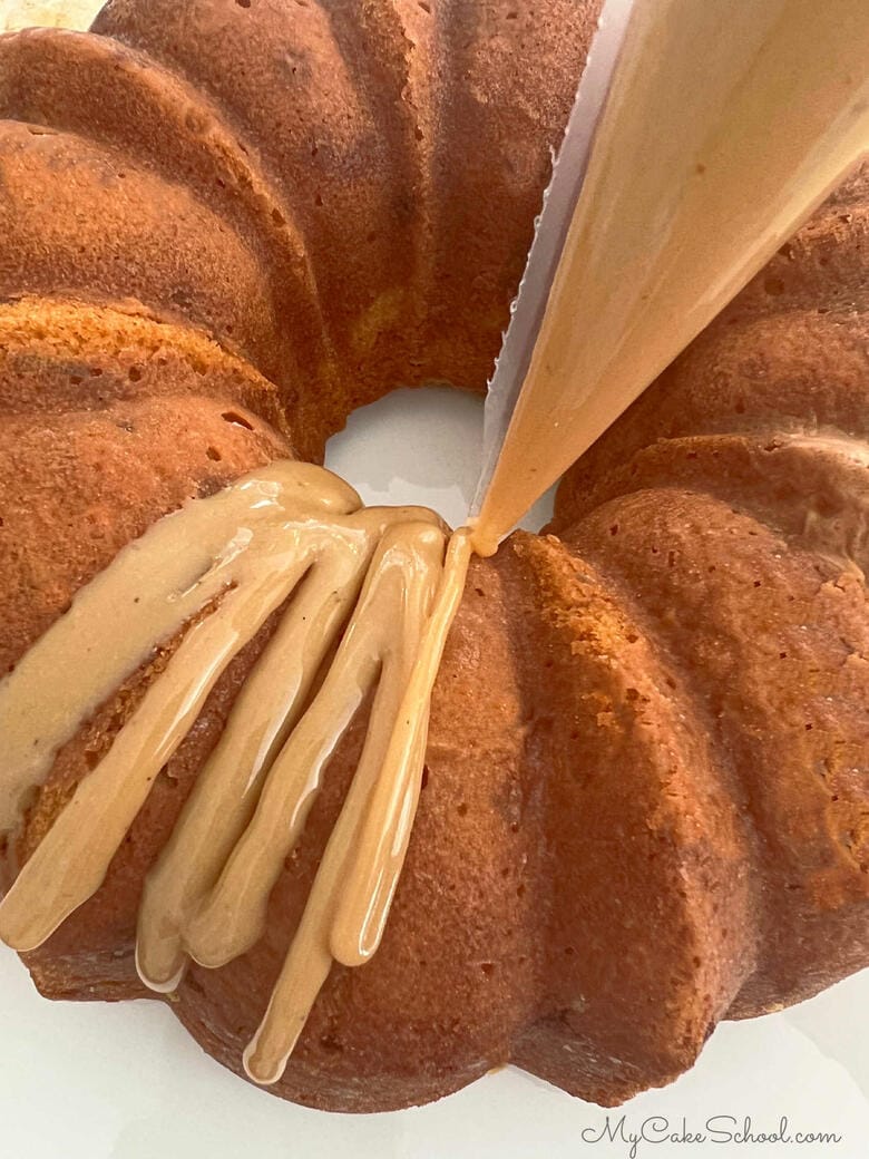 Adding caramel glaze to the pumpkin pound cake
