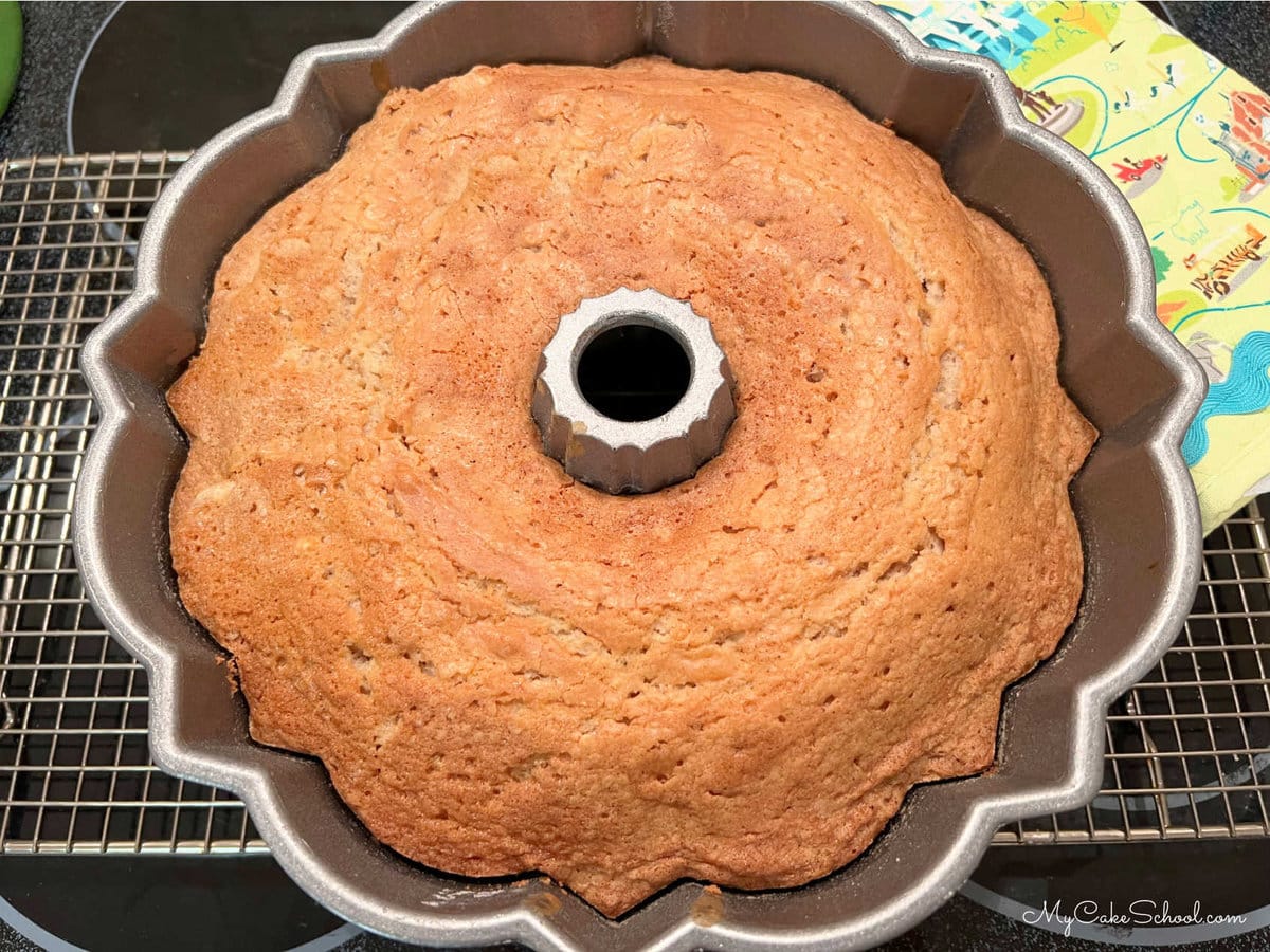 Freshly Baked Eggnog Pound Cake in pan (on wire rack)