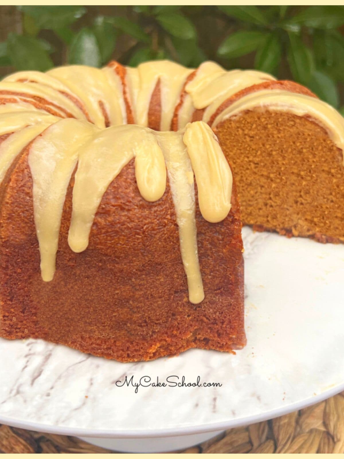 Gingerbread Pound Cake, sliced, on a cake pedestal.