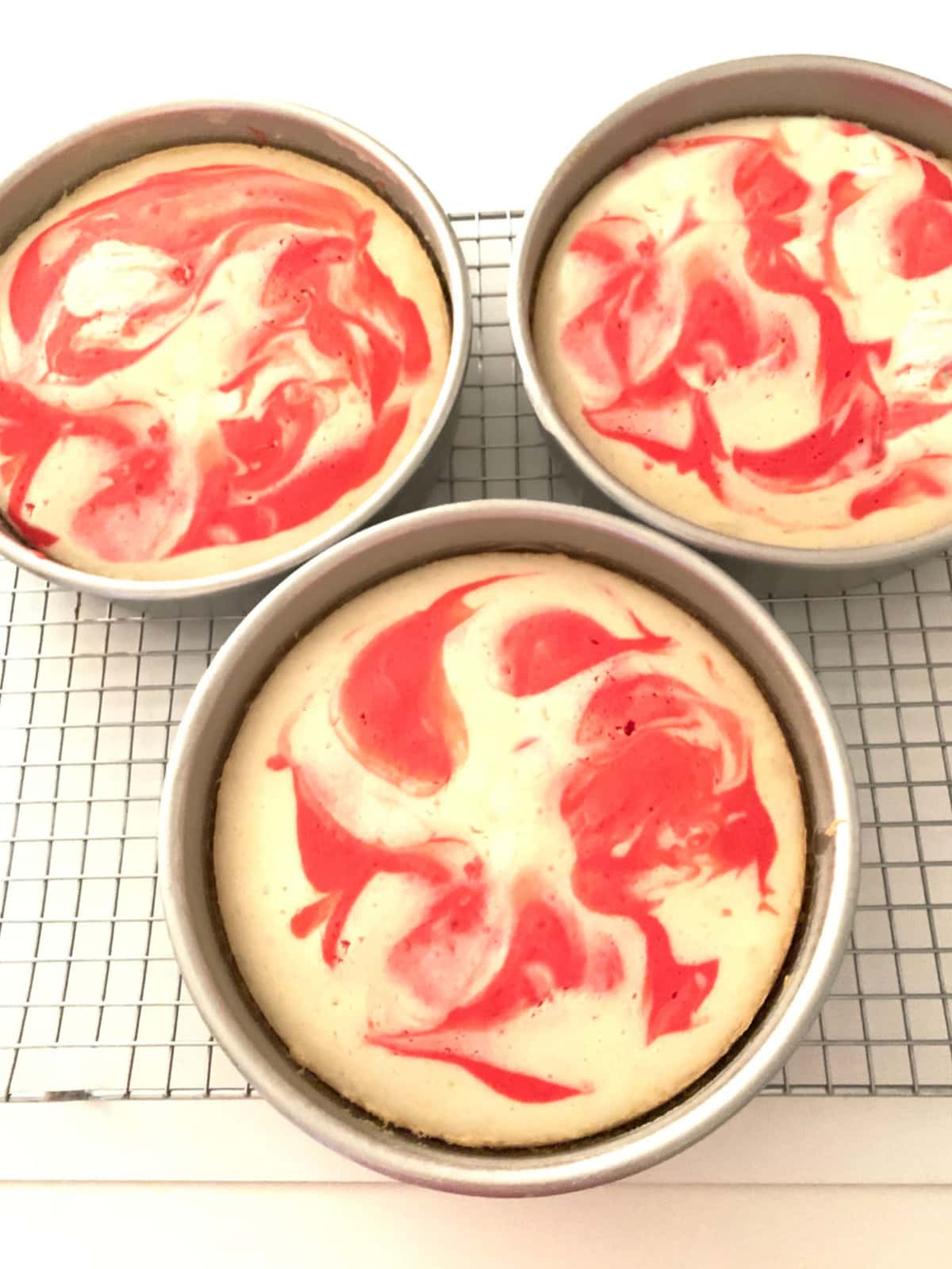 Peppermint Layer Cakes cooling in Pans on Wire Rack