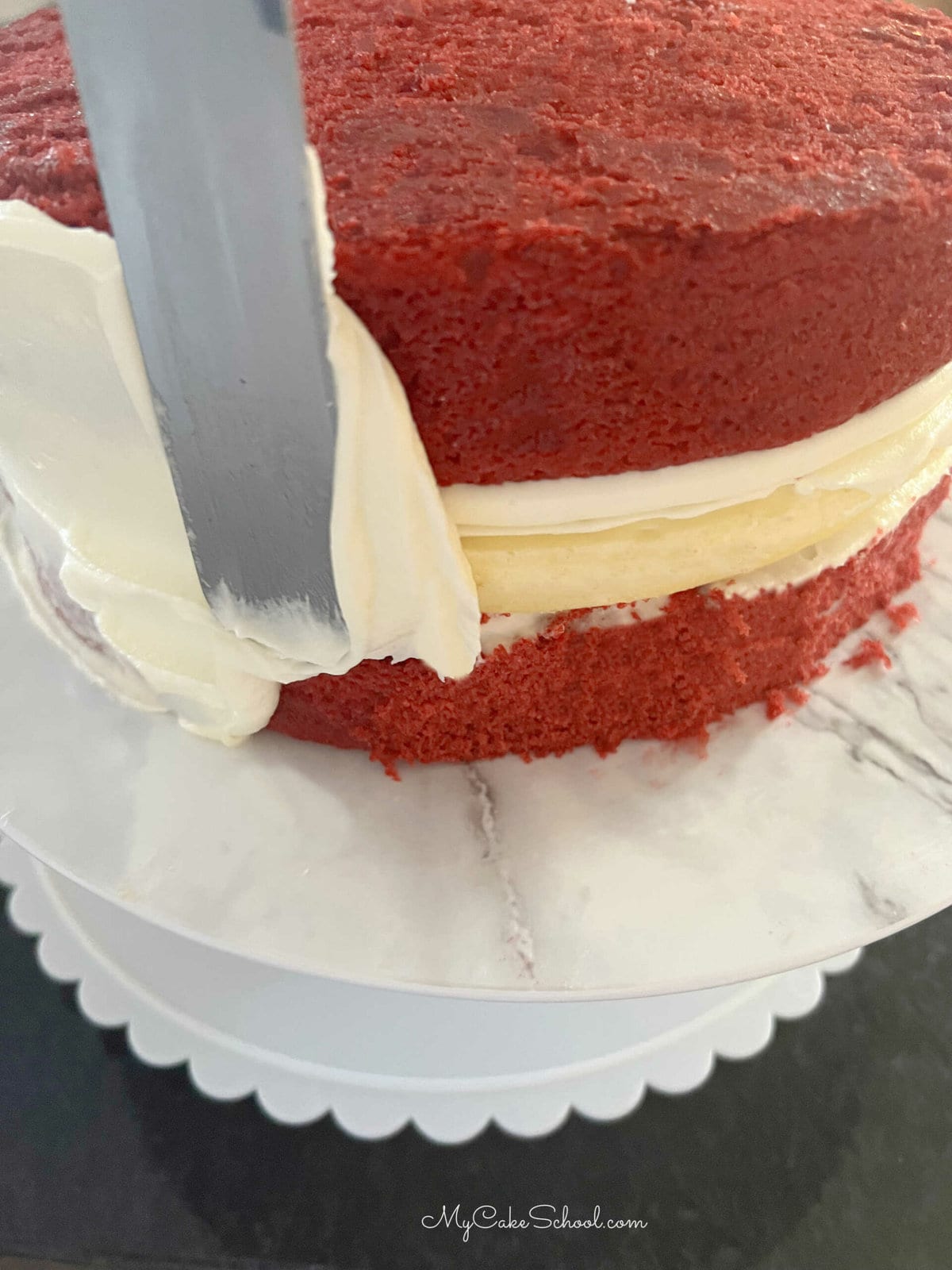 Frosting the Red Velvet Cheesecake Cake