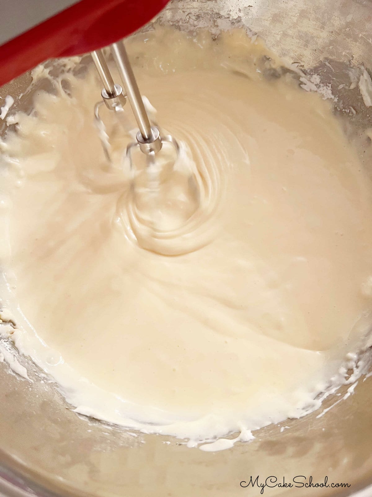 Mixing the cheesecake batter