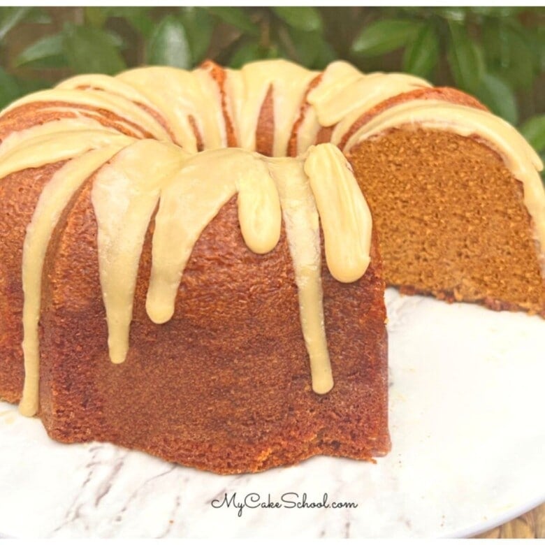 Gingerbread Pound Cake, sliced, on a cake pedestal.