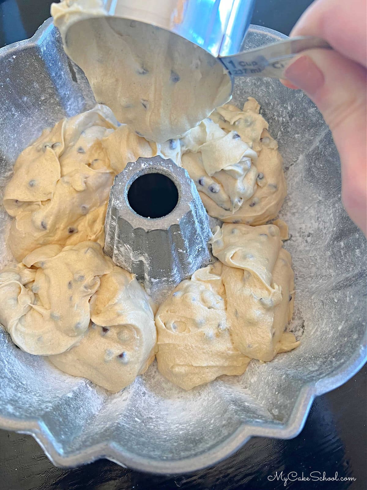 Adding the Chocolate Chip Cake Batter to Prepared Bundt Pan