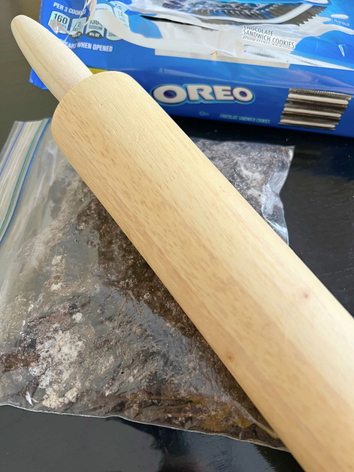 Crushed Oreos in Ziplock Bat with Rolling Pin on top