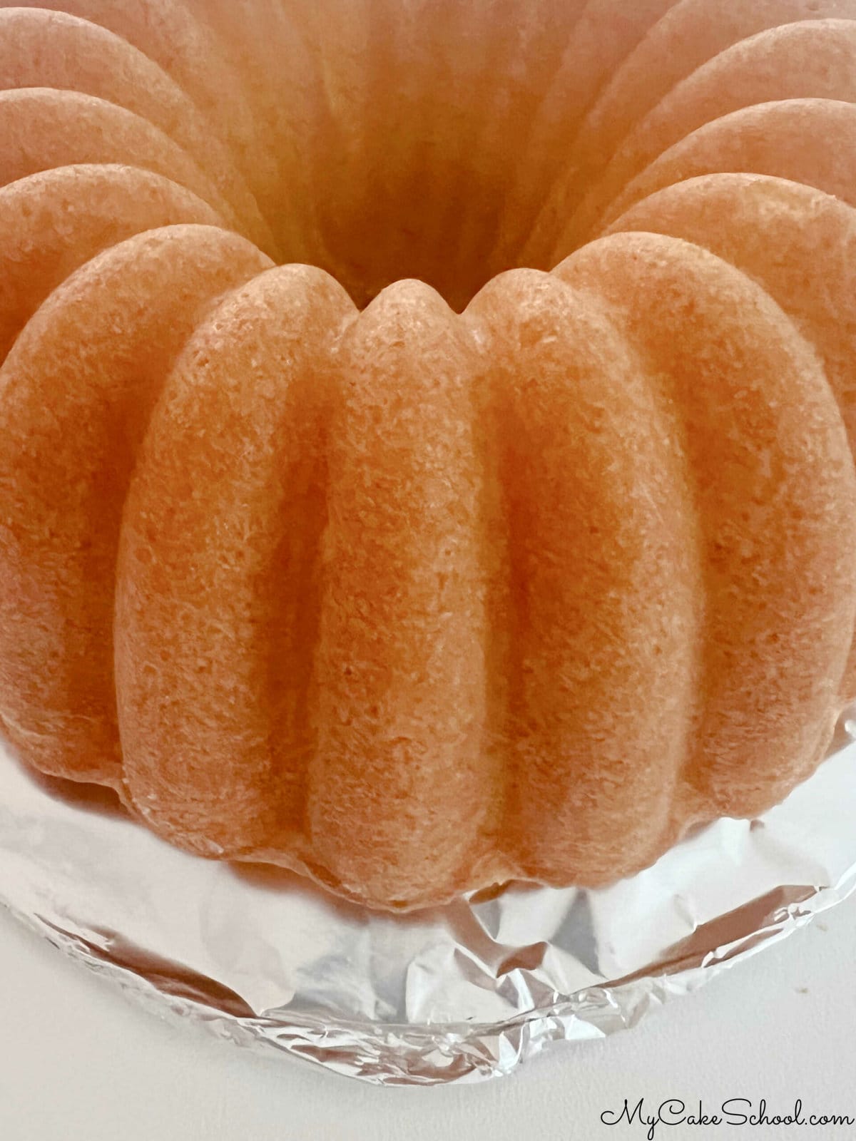 Lemon Bundt Cake on foil wrapped cake board