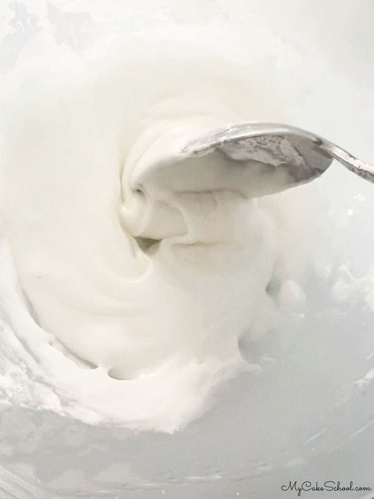 Mixing Lemon Glaze in Bowl