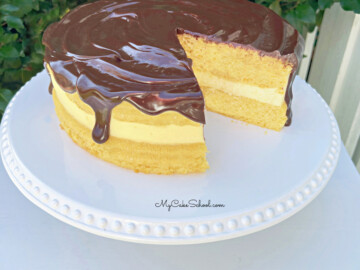 Boston Cream Pie from Cake Mix on a white pedestal