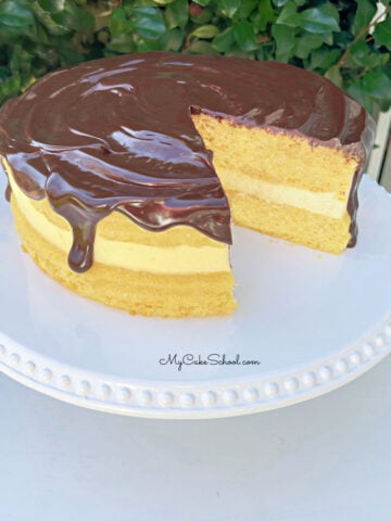 Boston Cream Pie from Cake Mix on a white pedestal