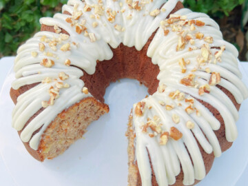 Sliced Hummingbird Bundt Cake on a white pedestal