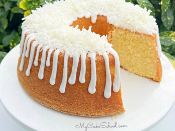 Sliced Lemon Coconut Pound Cake on pedestal