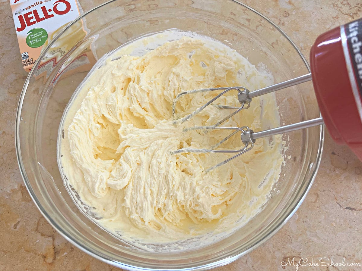 Bowl of Vanilla Cream Filling & Hand Mixer