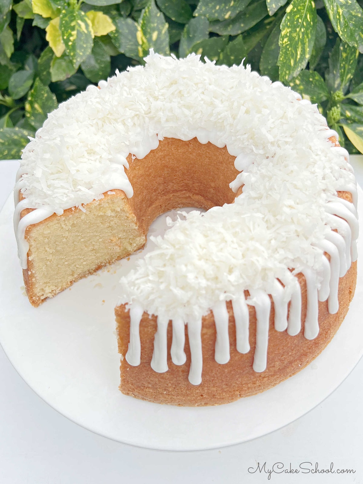 Overhead view of Lemon Coconut Pound Cake on pedestal