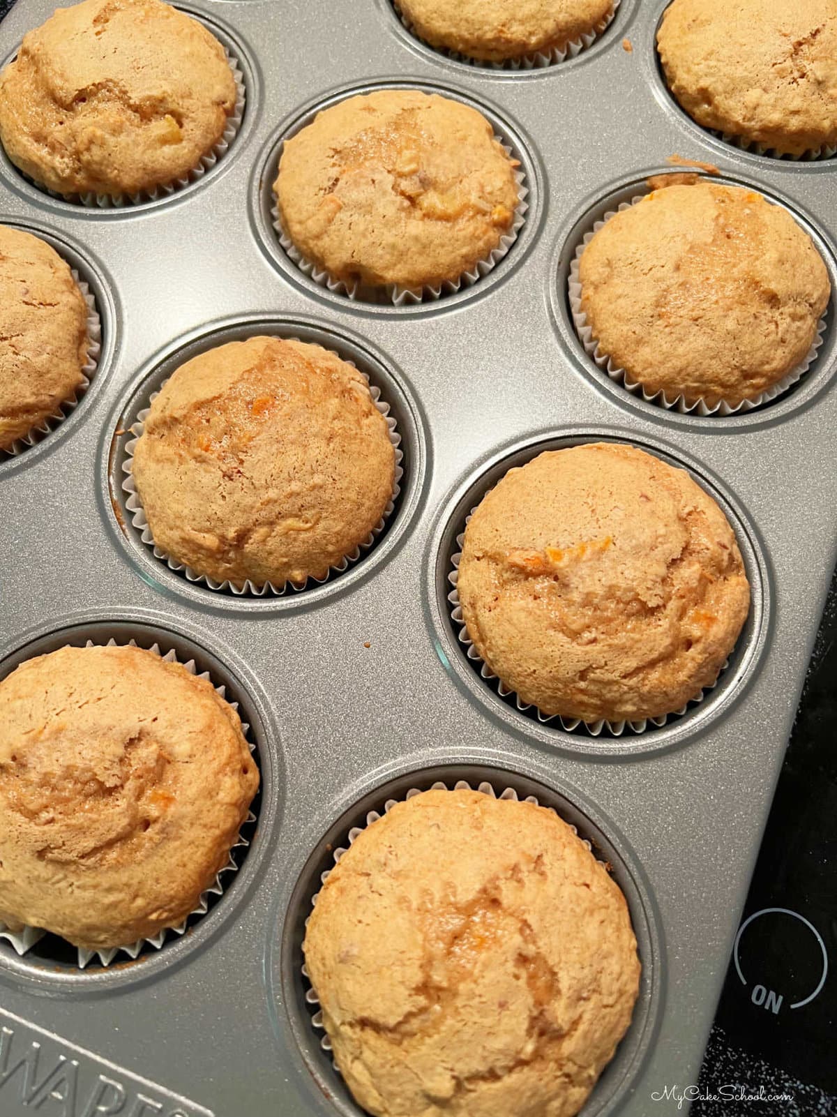 Freshly baked carrot cupcakes in the pan