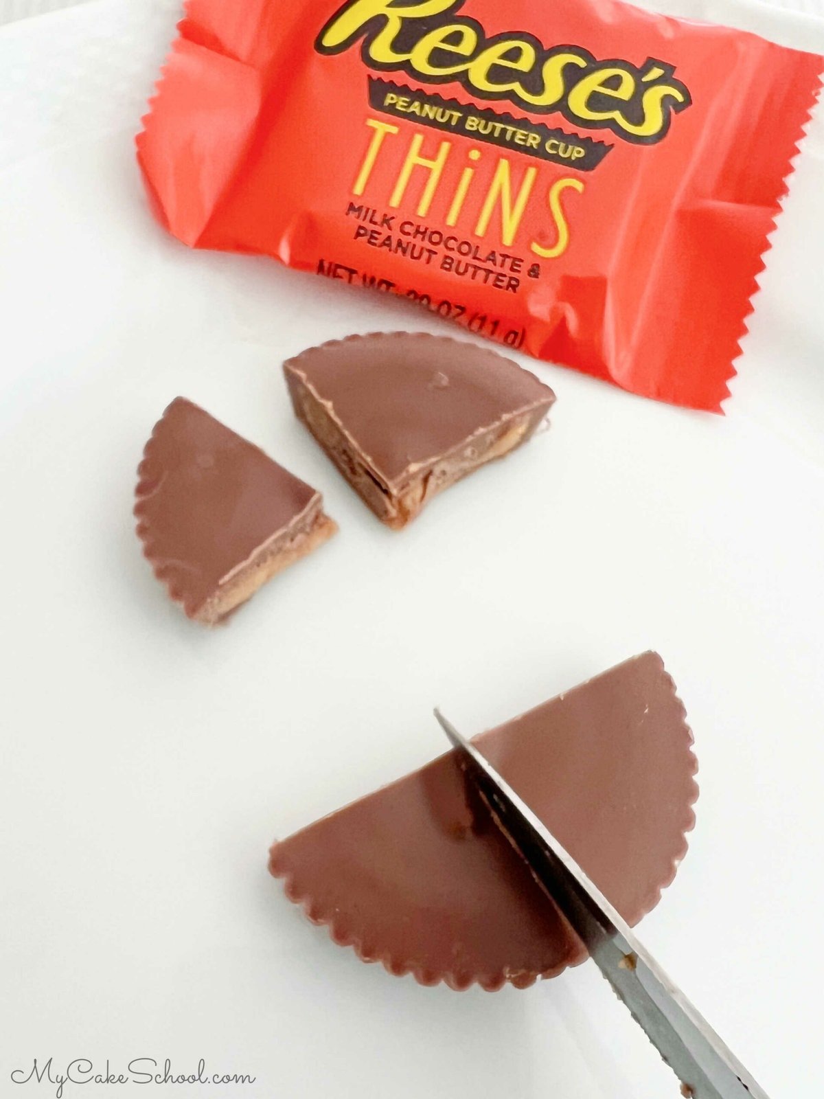 Reese's Peanut Butter Cup Thins, sliced in quarters to use a cupcake toppers