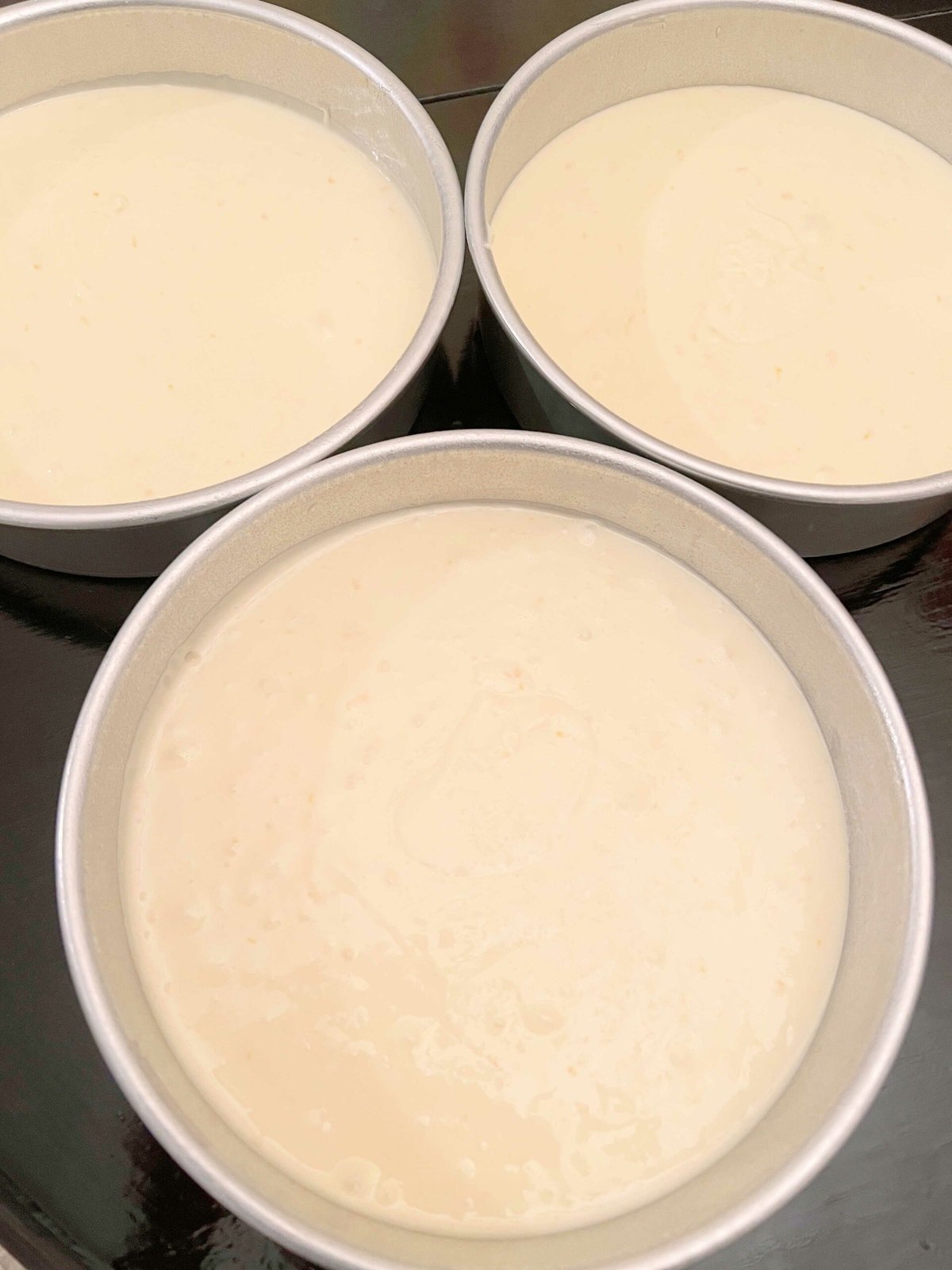 Lemon Cream Cake Batter in three 8 inch cake pans